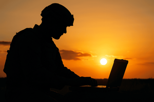 Case Study Header Image - Tactical Edge Computing Transforms Mission Capability for Defense Organization - soldier on ruggedized laptop