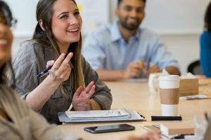 recent college grads collaborating in office space