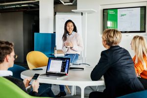 Employees meeting for a workshop in a modern conference room