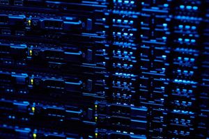 Close-up of illuminated server racks in a data center, representing high-performance network infrastructure and enterprise-scale computing.