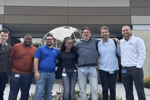 WWT Associate Academy participants and other WWT employees standing outside WWT's Advanced Technology Center