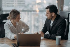 couple looking at laptop in an office