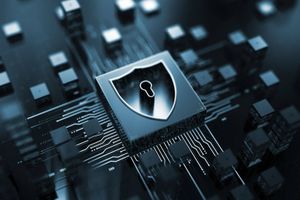 Shield icon embedded in a computer chip surrounded by interconnected circuitry, representing cybersecurity, data protection and secure AI infrastructure.  Provide your feedback on BizChat