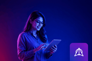 A woman with glasses stands holding a tablet, tapping its screen with a slight smile, lit in blue and purple tones against a dark background. A purple app icon appears in the bottom right corner.