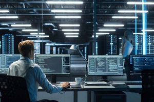 engineer working with monitors and servers