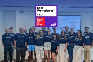 Team members wearing World Wide Technology shirts pose together at a volunteer event beneath a Best Workplaces in Tech UK 2026 recognition graphic.
