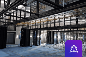 Photo of a modern data center with space ready for new racks to be installed.