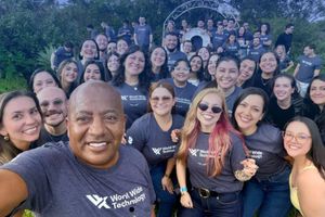 World Wide Technology team smiling outdoors, celebrating "Best Places to Work® in IT 2026".